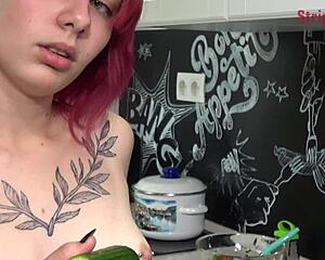 I tease Olivia with a cucumber in the kitchen