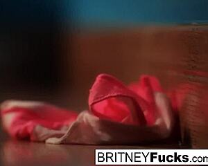 Britney Amber masturbates against blue wall