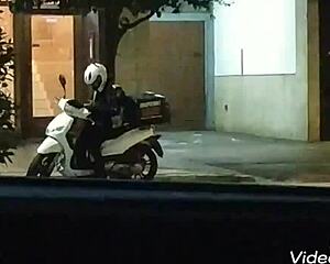 Handjob given on public road in outdoor setting