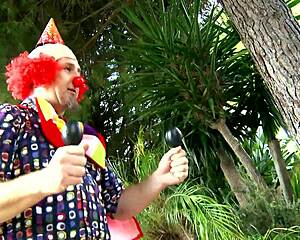 Sexy lady with massive Knockers gets f**ked By Clown