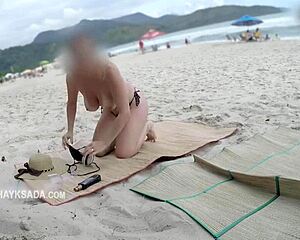 hot wife asks seller for sunscreen on beach