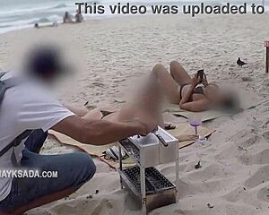 hot wife asks seller for sunscreen on beach