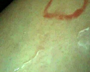 rita playfully interacts with a watermelon, showcasing her innocent charm.