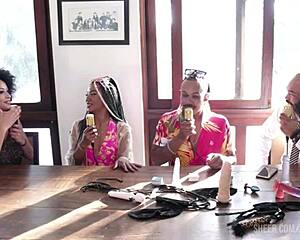 A black couple enjoys a sensual RJ session at the Santa Caliente event in sheer red lingerie