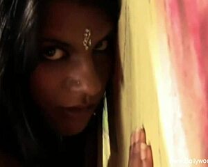 asian brunette dances nude on stage, teasing crowd with softcore movements and arousing expressions