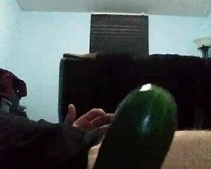 A gay man masturbates cucumber in ass