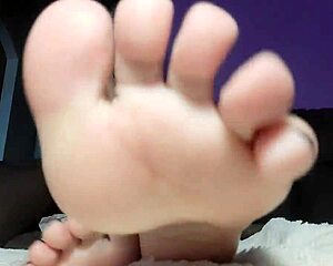 Seducing nurse showing her soles, fetish play