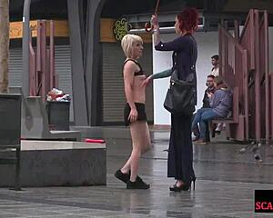 public slut gets humiliated on street by strict domina in harsh scene