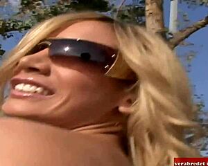 Blonde and brunette teens engage in lesbian sex using a big dildo