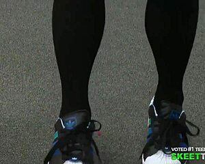 Blonde Teacher with Glasses in Classroom Setting