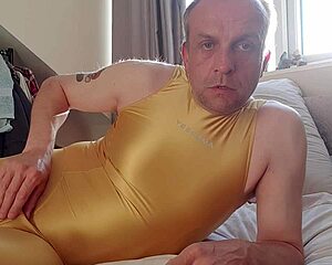 Shiny yellow spandex webcam solo guy shows off