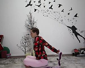 mature woman teaches yoga lesson to friend