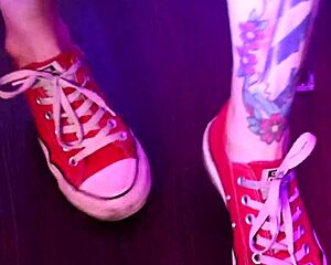 Footjob with the young sissy in sneakers
