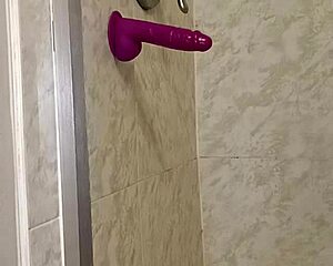 Sex with dildo in bathroom