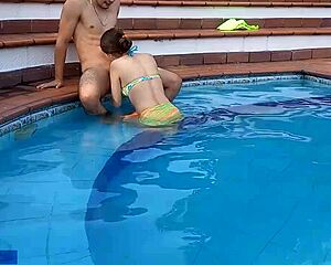 Latina chica bends over by pool with hermanastro!