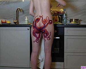 naked housewife with octopus tattoo on ass cooks in kitchen