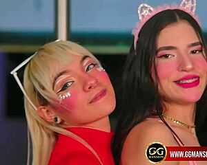 Blonde babe gives a blowjob to her black-haired friend