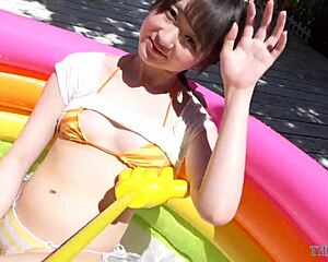 Pasha plays with water and enjoys the sun on her ass in a bikini