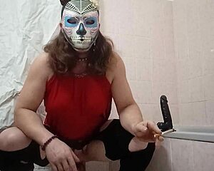 A travesti plays with a dildo in a fun way