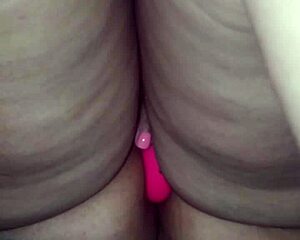 A girl’s solo satisfaction with a blue-tinged dildo