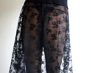 A brunette wears sheer pantyhose under her skirt for an upskirt view