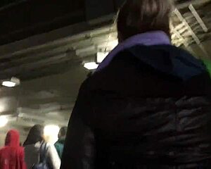 Chubby girl in brown nylon jacket in candid street photos