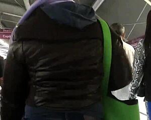 Chubby girl in brown nylon jacket in candid street photos