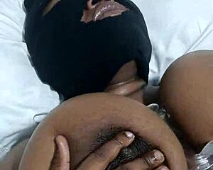 A black beauty with big boobs enjoys solo pleasure with a dildo