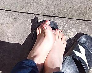 Feet soaking up the sun before pedicure