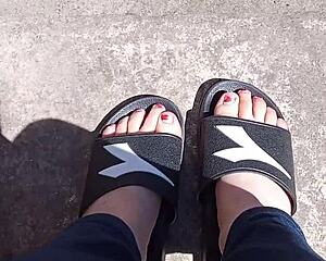 Feet soaking up the sun before pedicure