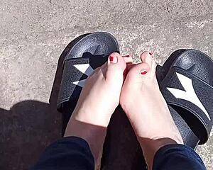 Feet soaking up the sun before pedicure