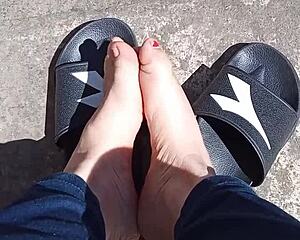 Feet soaking up the sun before pedicure