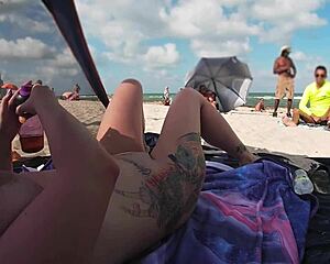 Married woman flaunts her shaved pussy at a nudist beach