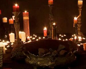 in a candlelit ritual, she masturbates passionately outdoors