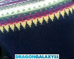 A brunette amateur gives an outdoor blowjob in the park, risking neighbors seeing