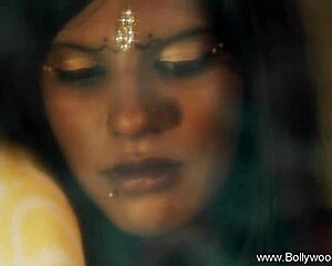 Is this bolly babe undressing and dancing in a teasing striptease