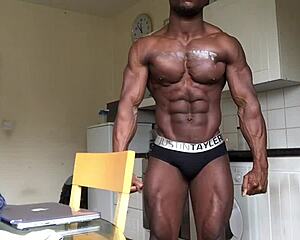 Watch this gay black bodybuilder flex on webcam?