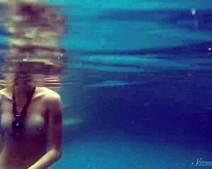 Naked beauty Wendy enjoys swimming in the pool