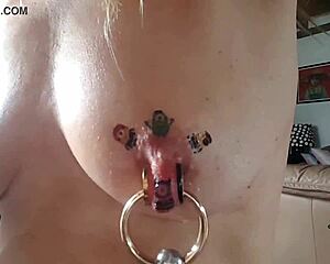 Close up of kinky European milf's pierced nipples