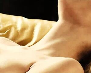 Blonde Delphine Fingers Her Small Tits On The Sofa.