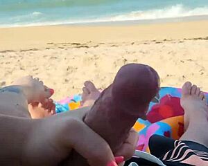 Public beach holiday turns into a big cock exhibition