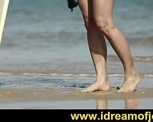 Brunette surfer on beach engages in subtle solo fingering and masturbation