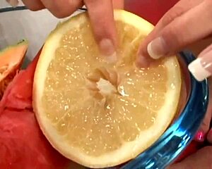 Amazing brunette squishes a melon with her sexy feet and gets fucked doggy style