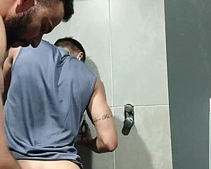 Muscle hunk gets his cock sucked in the gym