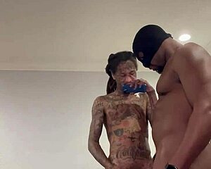 A gang bang with a masked man and big black cock