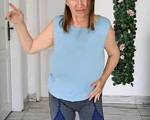 Busty braless gilf MariaOlds shows off sporty strip dance moves.