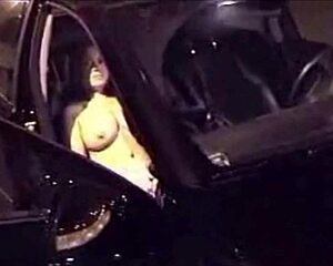 Big boobed woman pleasuring herself in the car