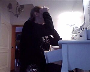 Wow, I can’t believe I’m spying on big tits while she’s getting ready! What a sneaky thrill!