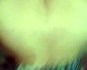 A couple shares a homemade POV moment in her floral dress.