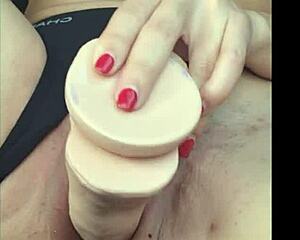 Solo girl masturbates with a toy while her boyfriend drives